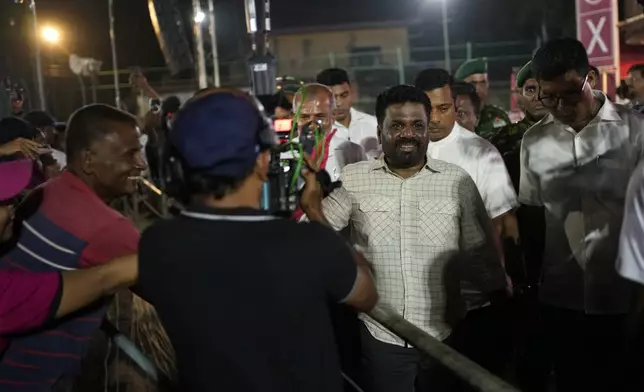 Sri Lankan President Anura Kumara Dissanayake leaves after a public rally ahead of Thursday's parliamentary election in Gampaha, Sri Lanka, Monday, Nov. 11, 2024. (AP Photo/Eranga Jayawardena)