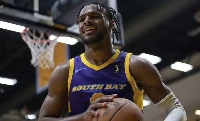 South Bay Lakers guard Bronny James holds the ball during the first half of an NBA G League basketball game against the Salt Lake City Stars, Saturday, Nov. 9, 2024, in El Segundo, Calif. (AP Photo/Eric Thayer)