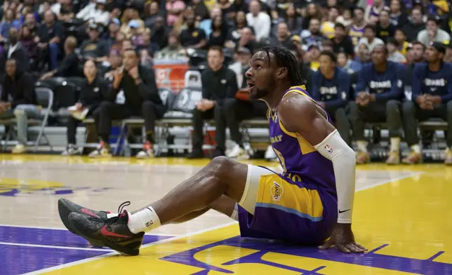 South Bay Lakers guard Bronny James gets up from the court during the first half of an NBA G League basketball game against the Salt Lake City Stars, Saturday, Nov. 9, 2024, in El Segundo, Calif. (AP Photo/Eric Thayer)