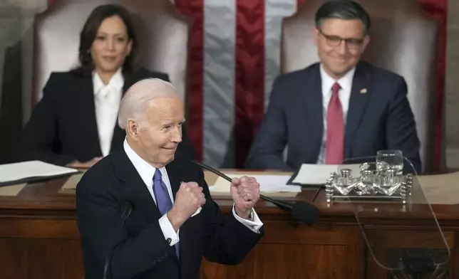 President Joe Biden gestures to Republicans as Vice President Kamala Harris and House Speaker Mike Johnson of La., watch during the State of the Union address to a joint session of Congress at the U.S. Capitol, Thursday March 7, 2024, in Washington. (AP Photo/Andrew Harnik)