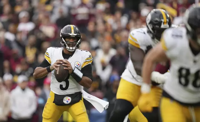 Pittsburgh Steelers quarterback Russell Wilson looks to pass during the first half of an NFL football game against the Washington Commanders, Sunday, Nov. 10, 2024, in Landover, Md. (AP Photo/Stephanie Scarbrough)