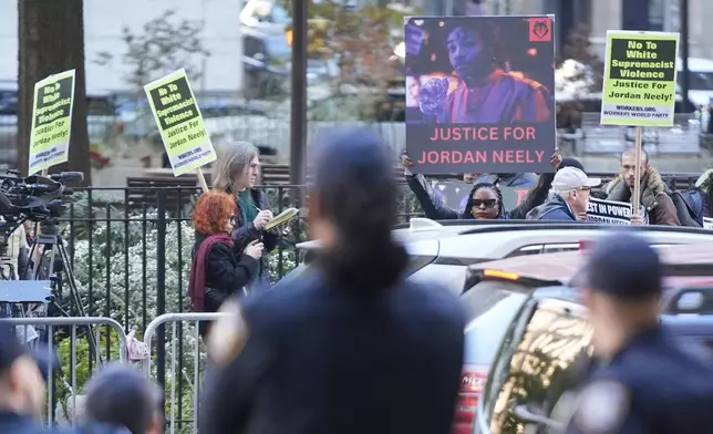 A group of people rally in support of justice for Jordan Neely across the street from the Manhattan criminal courts in New York, Monday, Oct. 21, 2024. (AP Photo/Seth Wenig)