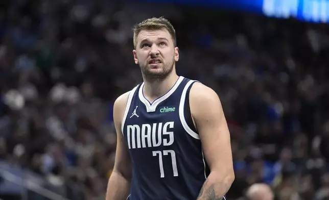 Dallas Mavericks guard Luka Doncic looks up from the floor during the first half of an NBA basketball game against the Phoenix Suns Friday, Nov. 8, 2024, in Dallas. (AP Photo/LM Otero)