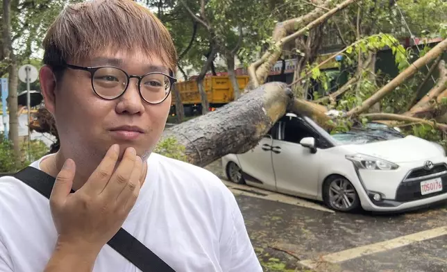 Song Zi-jie, 28 years old ride-hailing service driver, talks about his experience a day after a tree collapsed on his car while he was inside as Typhoon Kong-rey sweeps through Taipei, Taiwan on Friday, Nov. 1, 2024. (AP Photo/Johnson Lai)