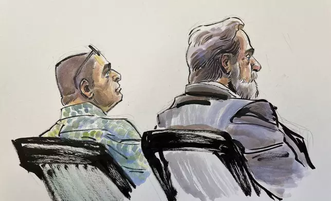 In this courtroom sketch, Richard Allen, left, is seated next to one of his defense attorneys, Andrew Baldwin, inside a courtroom at the Carroll County Courthouse in Delphi, Ind. on Monday, Oct. 28, 2024. (Li Buszka via AP, Pool)