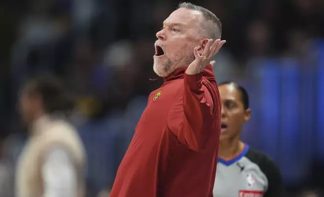 Denver Nuggets head coach Michael Malone argues with referees after guard Russell Westbrook was called for a technical foul in the first half of an NBA basketball game against the Oklahoma City Thunder Wednesday, Nov. 6, 2024, in Denver. (AP Photo/David Zalubowski)