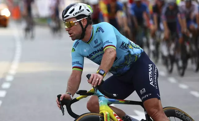 Mark Cavendish of Astana Qazaqstan competes in the Tour de France Prudential Singapore Criterium, Sunday, Nov. 10, 2024. (AP Photo/Danial Hakim)