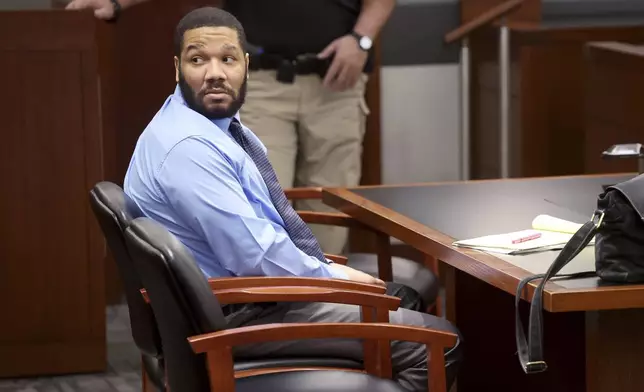 FILE - Defendant Julius Trotter, a previously convicted felon who is charged with breaking into a room at a Las Vegas Strip hotel-casino and robbing and killing two Vietnamese tour leaders in June 2018, waits in the courtroom for the verdict in his murder trial, Tuesday, Oct. 29, 2024, at the Regional Justice Center in Las Vegas. Trotter was sentenced Thursday, Oct. 31, to serve life in state prison with no chance of parole. (K.M. Cannon/Las Vegas Review-Journal via AP, File)