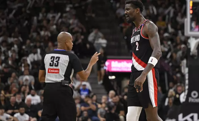 Portland Trail Blazers' Deandre Ayton (2) is called for a technical foul by referee Sean Corbin during the second half of an NBA basketball game against the San Antonio Spurs, Thursday, Nov. 7, 2024, in San Antonio. San Antonio won 118-105. (AP Photo/Darren Abate)