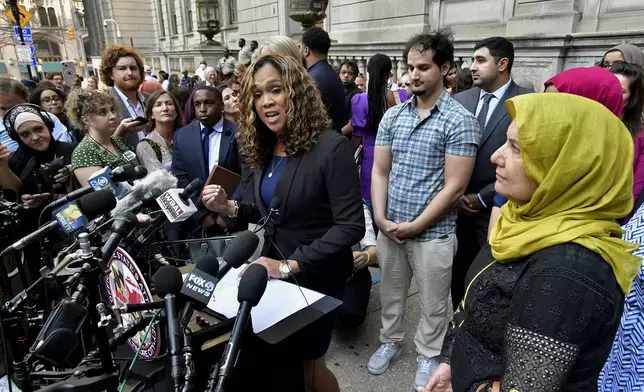 FILE - State's Attorney Marilyn Mosby discusses the release of Adnan Syed after his conviction was overturned, as Syed's mother, Shamim Syed, right, looks on with another son, standing behind Mosby, Sept. 19, 2022, in Baltimore. (Amy Davis/The Baltimore Sun via AP, File)