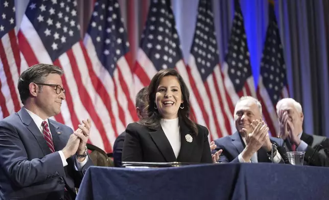 Rep. Elise Stefanik, R-N.Y., is acknowledged by President-elect Donald Trump, not shown, as he speaks during a meeting with the House GOP conference, Wednesday, Nov. 13, 2024, in Washington, as from left, House Speaker Mike Johnson of La., Rep. Steve Scalise, R-La., and Rep. Tom Emmer, R-Minn., look on. (AP Photo/Alex Brandon)