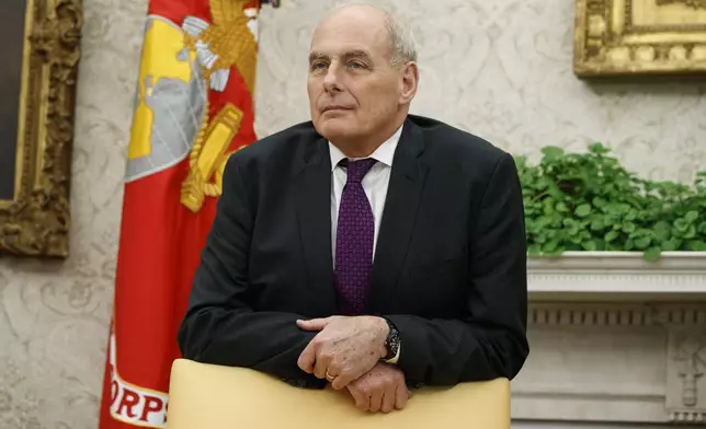 FILE - White House Chief of Staff John Kelly watches as President Donald Trump speaks in the Oval Office of the White House in Washington, Nov. 16, 2018. (AP Photo/Evan Vucci, File)