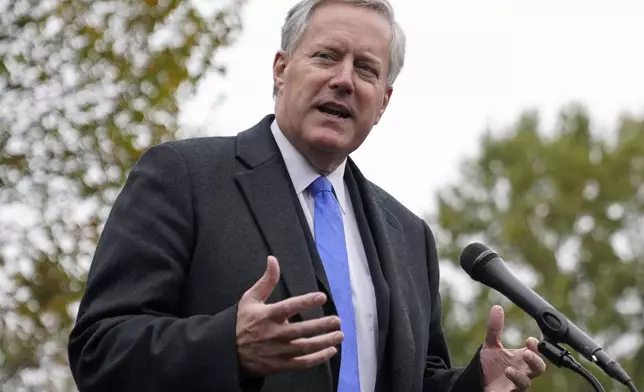 FILE - White House chief of staff Mark Meadows speaks with reporters outside the White House, Monday, Oct. 26, 2020, in Washington. (AP Photo/Patrick Semansky, File)