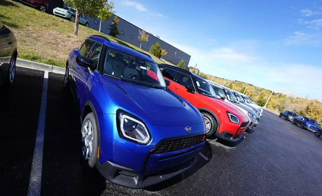 FILE - Unsold 2025 Countryman sports-utility vehicles sit on display at a Mini dealership on Oct. 21, 2024, in Highlands Ranch, Colo. (AP Photo/David Zalubowski, File)