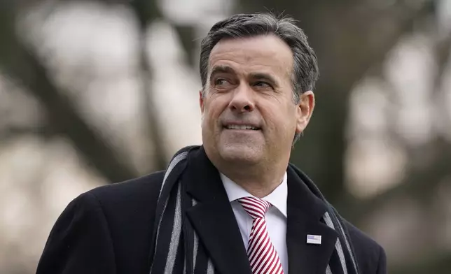 FILE - Director of National Intelligence John Ratcliffe waits to board Marine One with President Donald Trump on the South Lawn of the White House in Washington, Dec. 12, 2020. (AP Photo/Patrick Semansky, File)