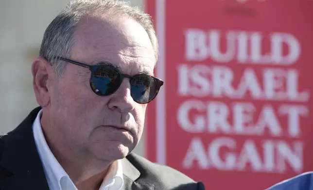 FILE - Gov. Mike Huckabee, R-Ark., takes questions from the media, prior to laying a brick at a new housing complex in the West Bank settlement of Efrat, Aug. 1, 2018. President-elect Donald Trump will nominate former Arkansas Gov. Mike Huckabee as ambassador to Israel. Trump said Tuesday that Huckabee is a staunch defender of Israel and his intended nomination comes as Trump has promised to align U.S. foreign policy more closely with Israel’s interests as it wages wars against Hamas in Gaza and Hezbollah in Lebanon.(AP Photo/Oded Balilty, File)