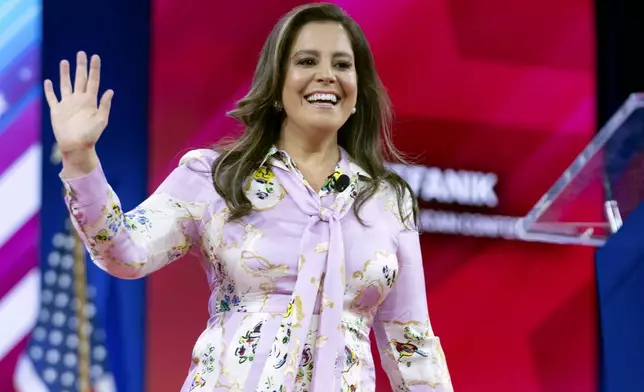 FILE - Republican Conference Chair Rep. Elise Stefanik, R-N.Y., waves to supporters at CPAC in Oxon Hill, Md., Feb. 23, 2024. President-elect Donald Trump has chosen Rep. Elise Stefanik to serve as his ambassador to the United Nations. (AP Photo/Jose Luis Magana, File)