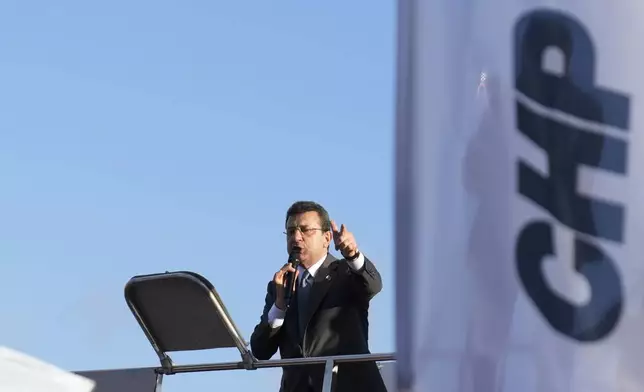 Istanbul Mayor, Ekrem Imamoglu addresses people during a protest against the arrest and removal from office of a mayor from Turkey's main opposition party for alleged links to a banned Kurdish militant group, in Istanbul, Turkey, Thursday, Oct. 31, 2024. (AP Photo/Khalil Hamra)