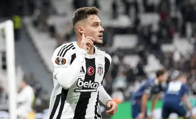 Besiktas' Ernest Muci celebrates after scoring the opening goal during the Europa League opening phase soccer match between Besiktas and Malmo at the Besiktas stadium in Istanbul, Turkey, Wednesday, Nov. 6, 2024. (AP Photo/Khalil Hamra)