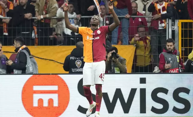 Galatasaray's Victor Osimhen celebrates after scoring his side's second goal during the Europa League opening phase soccer match between Galatasaray and Tottenham Hotspur at Ali Sami Yen stadium, in Istanbul, Turkey, Thursday, Nov. 7, 2024. (AP Photo/Khalil Hamra)