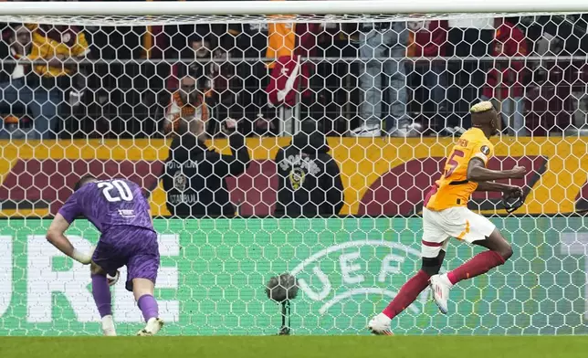 Galatasaray's Victor Osimhen celebrates after scoring his side's third goal during the Europa League opening phase soccer match between Galatasaray and Tottenham Hotspur at Ali Sami Yen stadium, in Istanbul, Turkey, Thursday, Nov. 7, 2024. (AP Photo/Khalil Hamra)