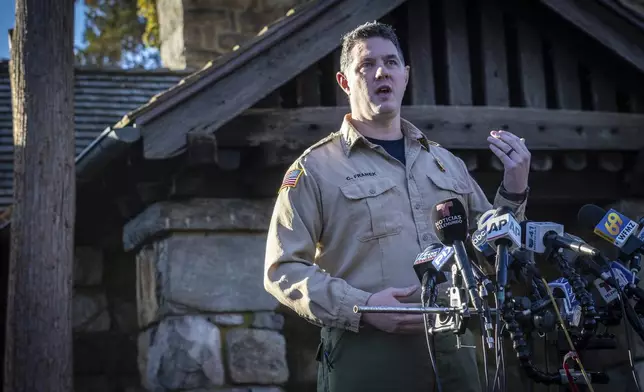 Assistant Division Fire Warden Chris Franek speaks to reporters during a briefing at the New Jersey Forest Fire Service Command Post, Monday, Nov. 11, 2024, in Ringwood, N.J. (AP Photo/Stefan Jeremiah)