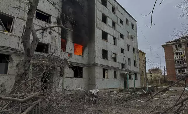 A multi-story building burns after a Russian strike on a residential neighbourhood in Kurakhove, Donetsk region, Ukraine, on Nov. 7, 2024. (AP Photo/Anton Shtuka)