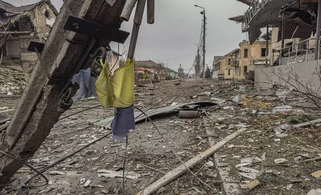 A central streets covered in debris from destroyed residential buildings after Russian bombing in Kurakhove, Donetsk region, Ukraine, on Nov. 7, 2024. (AP Photo/Anton Shtuka)