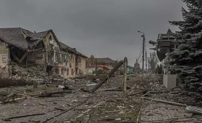 A central streets covered in debris from destroyed residential buildings after Russian bombing in Kurakhove, Donetsk region, Ukraine, on Nov. 7, 2024. (AP Photo/Anton Shtuka)