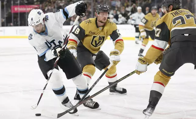 Utah Hockey Club center Nick Schmaltz (8) skates past Vegas Golden Knights center Jack Eichel (9) and defenseman Shea Theodore (27) during the first period of an NHL hockey game Saturday, Nov. 2, 2024, in Las Vegas. (AP Photo/Ian Maule)