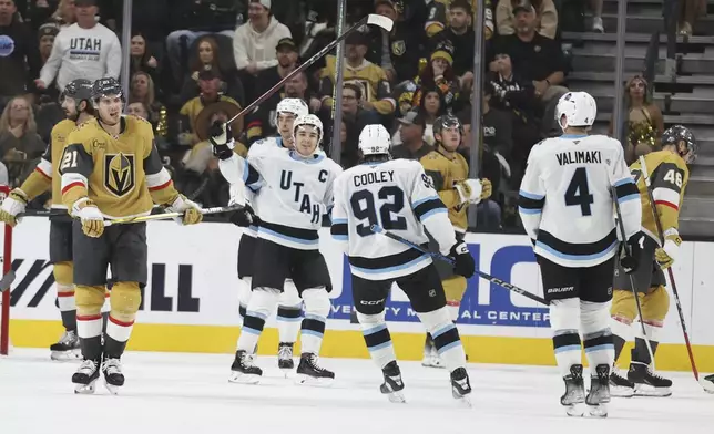 Utah Hockey Club center Clayton Keller (9) celebrates after scoring a goal during the second period of an NHL hockey game against the Vegas Golden Knights, Saturday, Nov. 2, 2024, in Las Vegas. (AP Photo/Ian Maule)