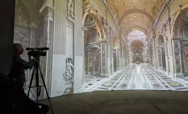 Images of St. Peter's Basilca are projected on a screen during the preview to the press of the exhibition 'Petros eni', which is part of the project "St. Peter's Basilica: AI-Enhanced Experience" at the Vatican, Saturday, Nov. 9, 2024. (AP Photo/Gregorio Borgia)