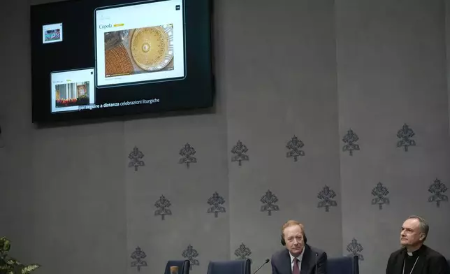 Cardinal Mauro Gambetti, right, and Microsoft's vice-Chairman and President Brad Smith unveil the project "St. Peter's Basilica: AI-Enhanced Experience" during a press conference. at the Vatican, Monday, Nov. 11, 2024. (AP Photo/Gregorio Borgia)