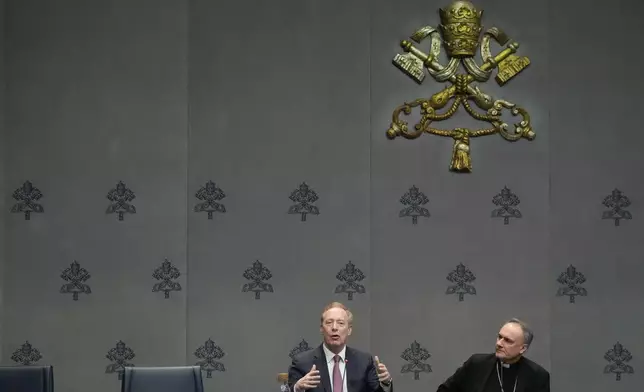 Cardinal Mauro Gambetti, right, and Microsoft's vice-Chairman and President Brad Smith unveil the project "St. Peter's Basilica: AI-Enhanced Experience" during a press conference at the Vatican, Monday, Nov. 11, 2024. (AP Photo/Gregorio Borgia)