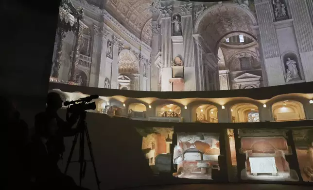 Images of St. Peter's Basilca are projected on a screen during the preview to the press of the exhibition 'Petros eni', which is part of the project "St. Peter's Basilica: AI-Enhanced Experience" at the Vatican, Saturday, Nov. 9, 2024. (AP Photo/Gregorio Borgia)