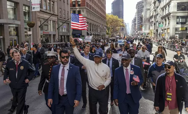 New York City Mayor Eric Adams marches in the annual Veterans Day Parade, Monday, Nov. 11, 2024, in New York. (AP Photo/Adam Gray)