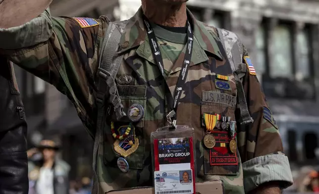 Vietnam War veteran Jose Alvarez, 72, salutes during the national anthem during the annual Veterans Day Parade, Monday, Nov. 11, 2024, in New York. (AP Photo/Adam Gray)