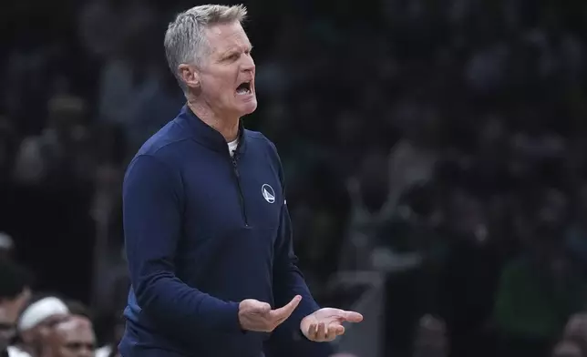 Golden State Warriors head coach Steve Kerr calls to his players during the first half of an NBA basketball game against the Boston Celtics, Wednesday, Nov. 6, 2024, in Boston. (AP Photo/Charles Krupa)