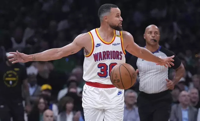 Golden State Warriors guard Stephen Curry calls to his teammates while trailing the Boston Celtics during the first half of an NBA basketball game, Wednesday, Nov. 6, 2024, in Boston. (AP Photo/Charles Krupa)