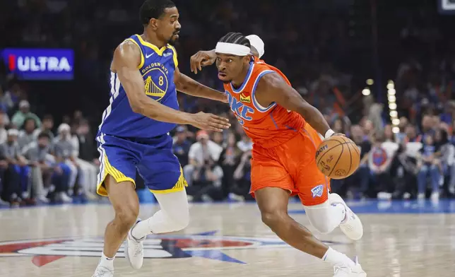 Oklahoma City Thunder guard Shai Gilgeous-Alexander, right, drives against Golden State Warriors guard De'Anthony Melton (8) during the first half of an NBA basketball game, Sunday, Nov. 10, 2024, in Oklahoma City. (AP Photo/Nate Billings)