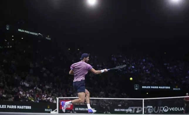 Russia's Karen Kachanov returns to France's Ugo Humbert during the semifinal match of the Paris Masters tennis tournament at the Accor Arena on Saturday, Nov. 2, 2024, in Paris. (AP Photo/Thibault Camus)