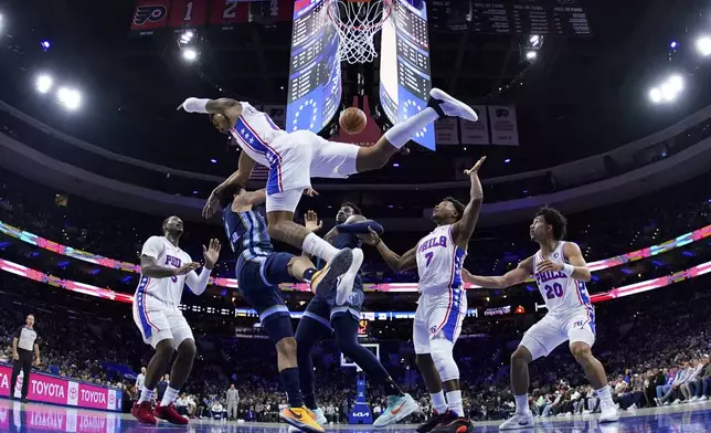 Memphis Grizzlies' Scotty Pippen Jr., left, and Philadelphia 76ers' KJ Martin collide during the first half of an NBA basketball game, Saturday, Nov. 2, 2024, in Philadelphia. (AP Photo/Matt Slocum)