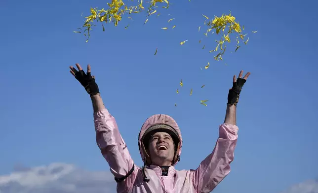 Flavien Prat celebrates after riding Sierra Leone to victory in the Breeders' Cup Classic horse race in Del Mar, Calif., Saturday, Nov. 2, 2024. (AP Photo/Gregory Bull)