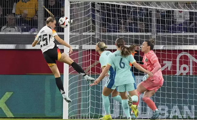 Germany's Selina Cerci scores the opening goal against Australia's goalkeeper Mackenzie Arnold during the international women's friendly soccer match between Germany and Australia in Duisburg, Germany, Monday, Oct. 28, 2024. (AP Photo/Martin Meissner)