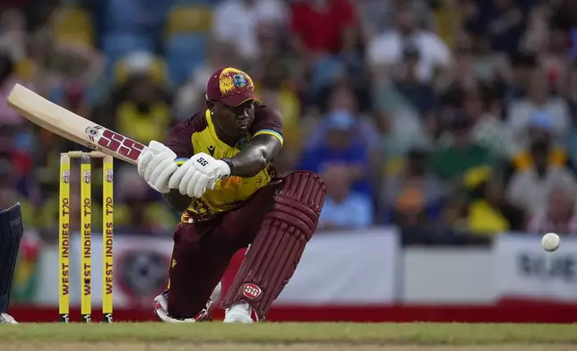 West Indies' captain Rovman Powell play against England during the second T20 cricket match at Kensington Oval in Bridgetown, Barbados, Sunday, Nov. 10, 2024. (AP Photo/Ricardo Mazalan)