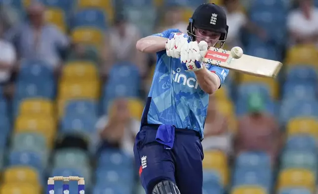 England's Dan Mousley plays a shot from the bowling of West Indies' Alzarri Joseph during the third ODI cricket match at Kensington Oval in Bridgetown, Barbados, Wednesday, Nov. 6, 2024. (AP Photo/Ricardo Mazalan)