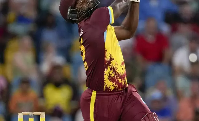 West Indies' Sherfane Rutherford plays a shot against England during the second T20 cricket match at Kensington Oval in Bridgetown, Barbados, Sunday, Nov. 10, 2024. (AP Photo/Ricardo Mazalan)