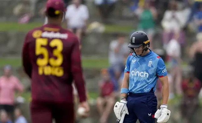 England's Jacob Bethell reacts after his dismissal, caught by West Indies' Brandon King, during the first ODI cricket match at Sir Vivian Richards Ground in North Sound, Antigua and Barbuda, Thursday, Oct. 31, 2024. (AP Photo/Ricardo Mazalan)