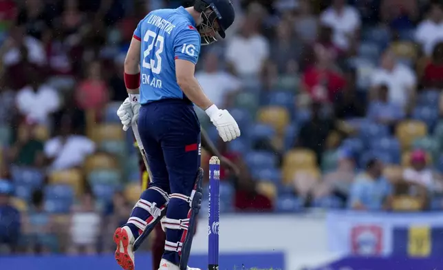 England's captain Liam Livingstone looks down after he was caught by West Indies' captain Shai Hope during the third ODI cricket at Kensington Oval in Bridgetown, Barbados, Wednesday, Nov. 6, 2024. (AP Photo/Ricardo Mazalan)