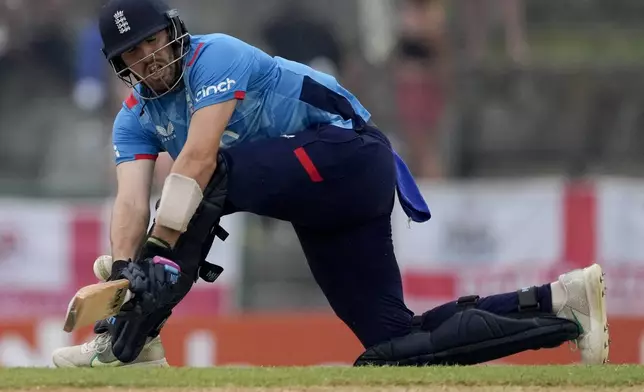 England's Jamie Overton is dismissed LBW by West Indies' Gudakesh Motie during the first ODI cricket match at Sir Vivian Richards Ground in North Sound, Antigua and Barbuda, Thursday, Oct. 31, 2024. (AP Photo/Ricardo Mazalan)